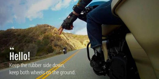 Motorcyclists point two fingers down, why?